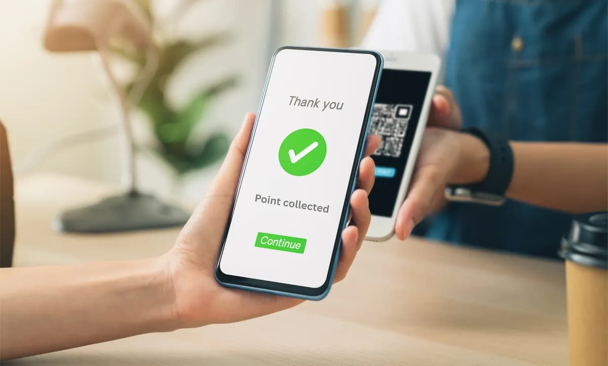 A customer collecting a loyalty point on their phone with Spotlit
